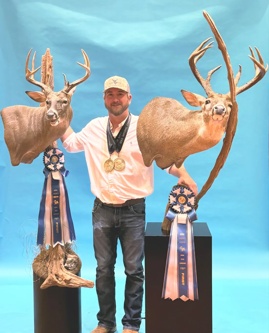 Cole Mears with his Gold National Champion medals and two first-place pedestal mounts