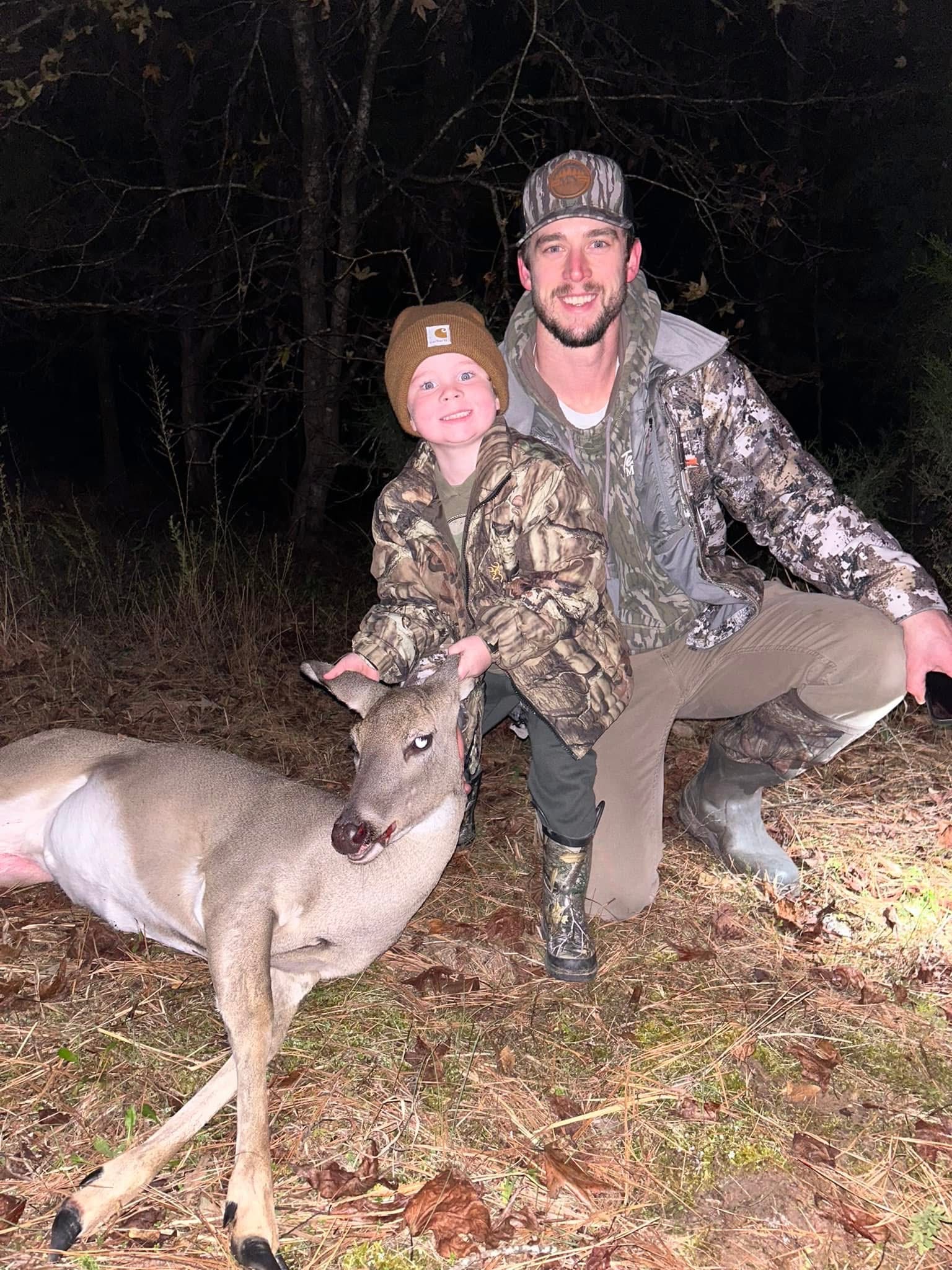 Hunter Mears with his son Tripp after an evening deer hunt