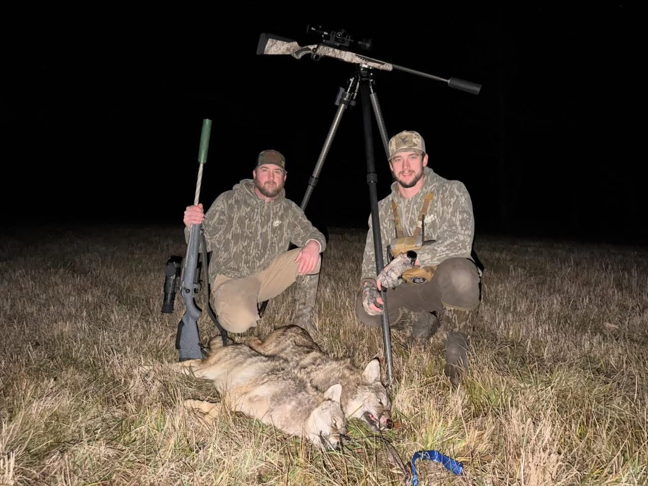 Cole and Hunter Mears coyote hunting at night with rifles and a taken coyote
